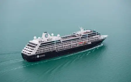 Azamara Quest cruise ship at anchor near port aerial view